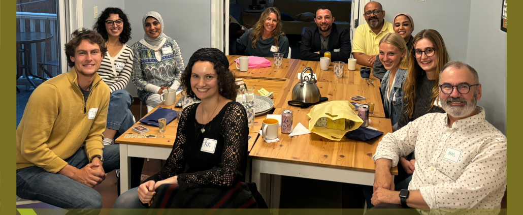 Dinner Hospitality with international visitors and hosts around a table enjoying discussion.