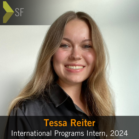 Global Ties San Francisco intern Tessa Reiter smiling toward camera, with organization logo in top left corner and a text box at the bottom of the image with the intern's name and position title.