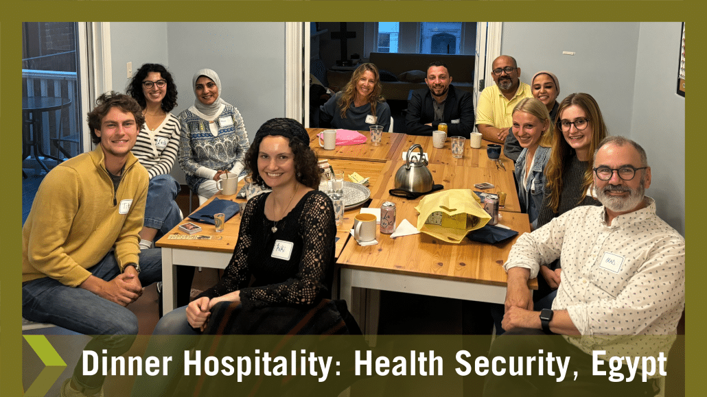 Dinner Hospitality with international visitors and hosts around a table enjoying discussion.