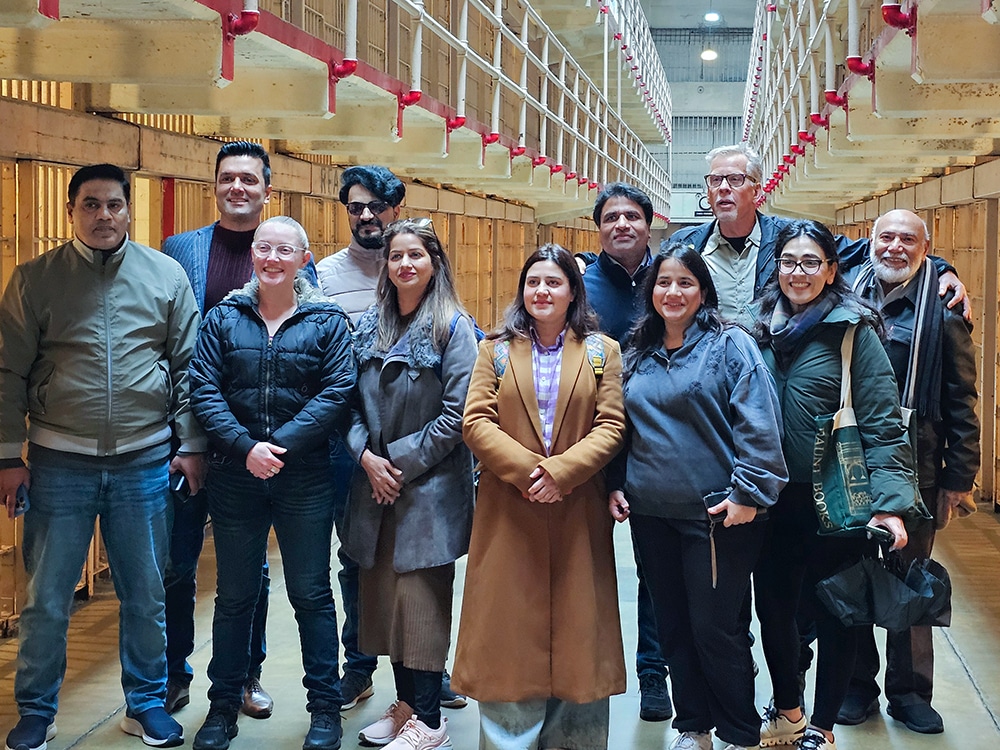 International Visitors exploring Alcatraz Island's cellhouse